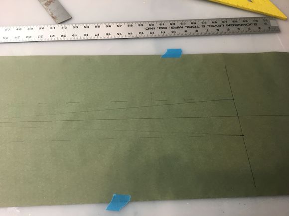 Rudder horns to rear.  Solid line is crossed cables dashed line is straight cables