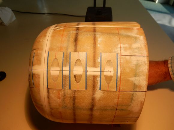 Cowling Latches: A layer of painters tape covered w/ masking tape w/ latch outlines pre-cut. Resin & Micro-Balloon mix trowelled in. When dry, sanded flush to tape. Perfect!