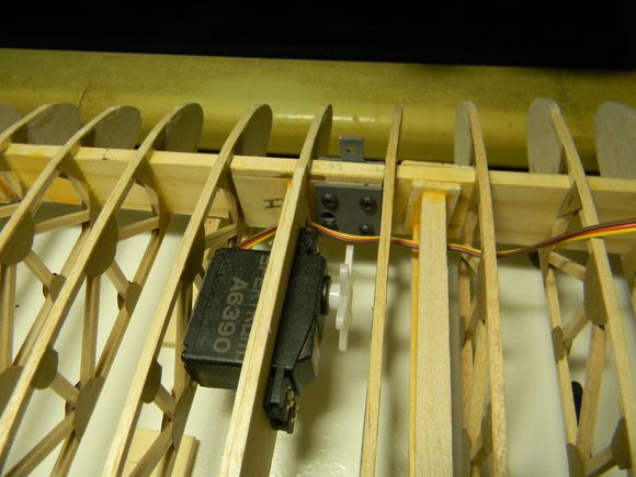 Servo must be flipped end for end to make room for the flying wire mount. 