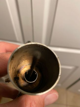 Ok here’s a photo.  Maybe the piece broke off and it’s not a two piece. . . . 
How would this affect the running now that the other piece is gone.  ?
Maybe the exhaust will escape better??
