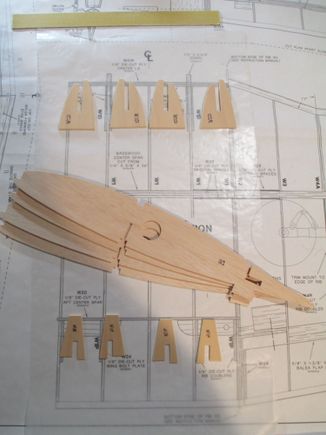 Before I can start to assemble the Center Section, the four W1 ribs need to be reinforced with the 1/8" birch plywood doublers that you see.  These will be epoxied to the appropriate side(s) of each rib.  Care must be taken to be sure that each doubler is epoxied on the correct side of each rib...