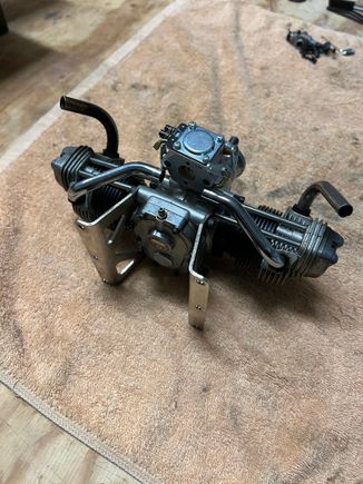 I want the carb intake facing forward so the stock mount won't work.  I'll have to make my own mount/intake manifold.