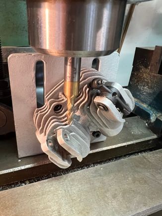 I threaded holes in the pattern of the head into a scrap angle bracket I had kicking around.  Was I nervous machining into my precious heads. Nawwww. . . . . .. 