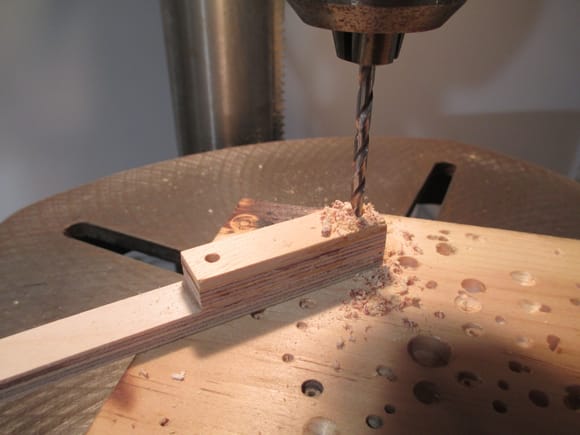 Using a drill press ensures that each of the four 5/32" holes are straight.