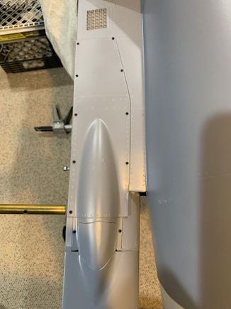 Air brake access panels mounted to bottom of fuselage 