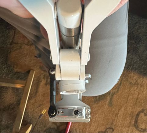 Seems who ever drilled and mounted that light got it crooked.. the Factory did this.