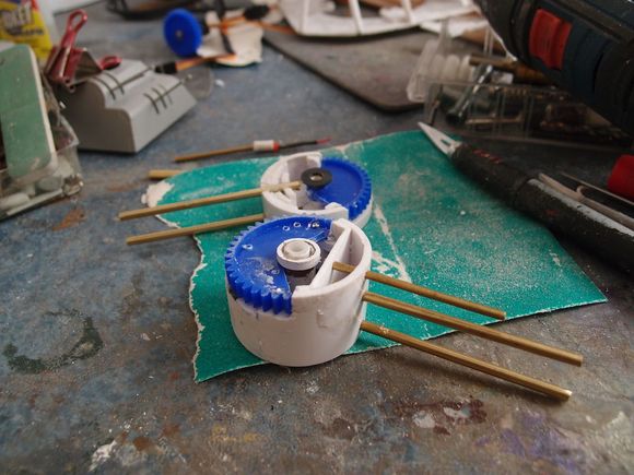 The drums and gearing for elevation.