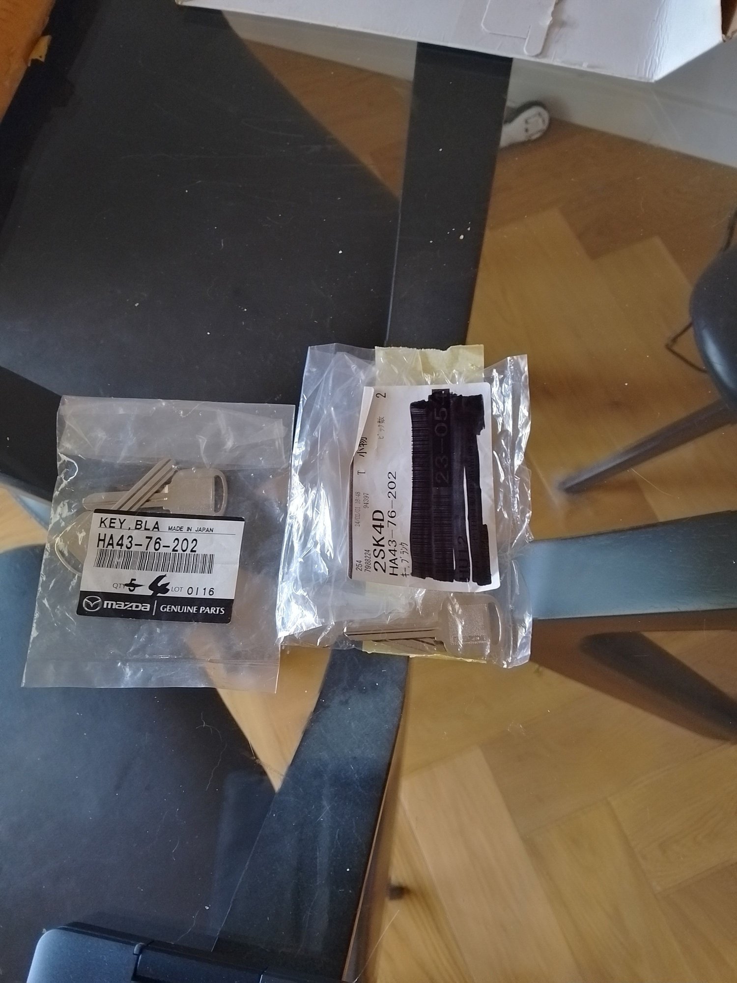 Mazda Genuine keys for Coupe.  I only have one set so it is time to have new ones cut.