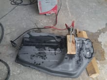 Finally getting a chance to work on the car , started the electrolysis on the gas tank. I can't wait until tomorrow to see how it comes out. 
Thanks Qingdao