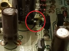 The 1,000uF capacitor leakage within the red circle.