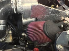 Ambient air temp supplied to turbo with a 6” pipe to the filter which is fed by opening around headlamp. Filter is insulated from radiator exit heat by a wrapped aluminum plate  
