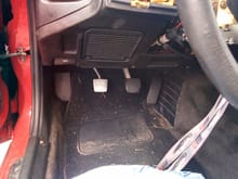 Manual pedals bolted into car.