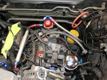 Engine bay TB + UIM removed and fuel lines disconnected.