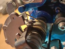 Bracket points to the main spring attachment bracket!