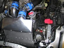 Installed Greddy Intercooler Sept '09, modified stock intercooler duct.  AWR racing radiator below.