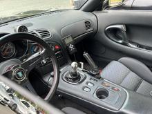Base seats are as nice as any. Soft texture replacement centre shift surround may still be available from Mazda parts desk.