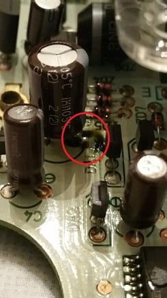 The 1,000uF capacitor leakage within the red circle.