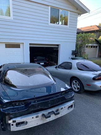 Next to the new silver one, with the twincharged car hiding in the garage