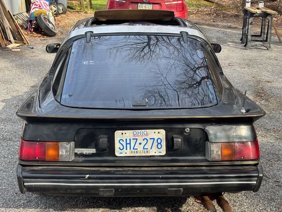 Yep. Original owner optioned the spoiler and targa band.