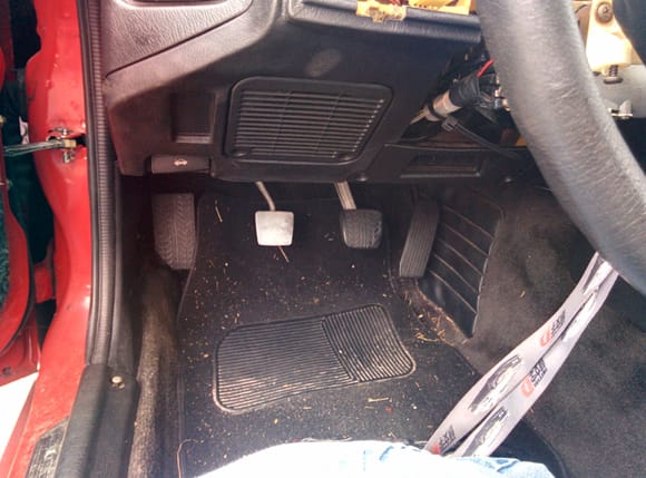 Manual pedals bolted into car.