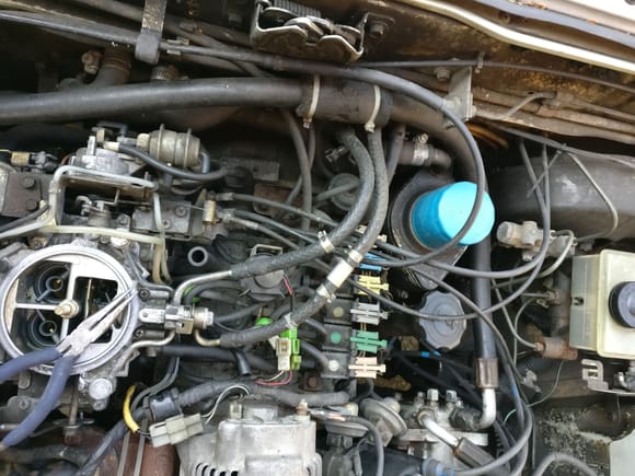 Before the engine bay was covered in overflowing gas and barfed up oil.