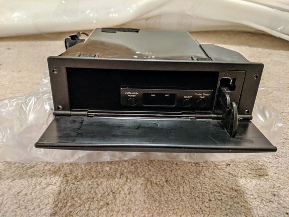 Single DIN compartment w/door and Greddy turbo timer/harness - $135