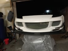The front bumper with the carbon fiber lip and canards