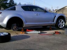 (3/12/11) Got the car up on jacks to paint my rotors and calipers.