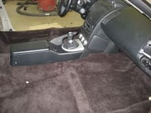 carpet and console... this is the ACC carpet installed...the color in this pix is a little off, it is actually charcoal... the center console I made myself from .060 aluminum and covered it with vinyl... the dash is 2008 350Z