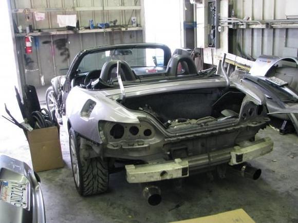 rear view of car being disassembled.