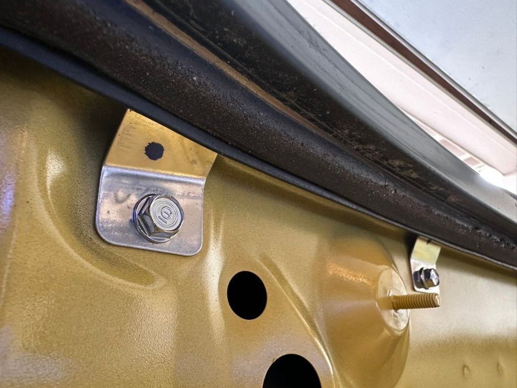 25 year old grime around the rear drain area. The weatherseal is also showing some age. 