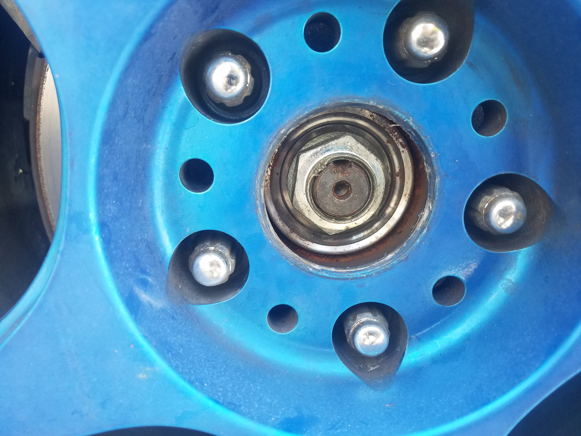 Can an impact from a collision loosen an axle nut? S2KI