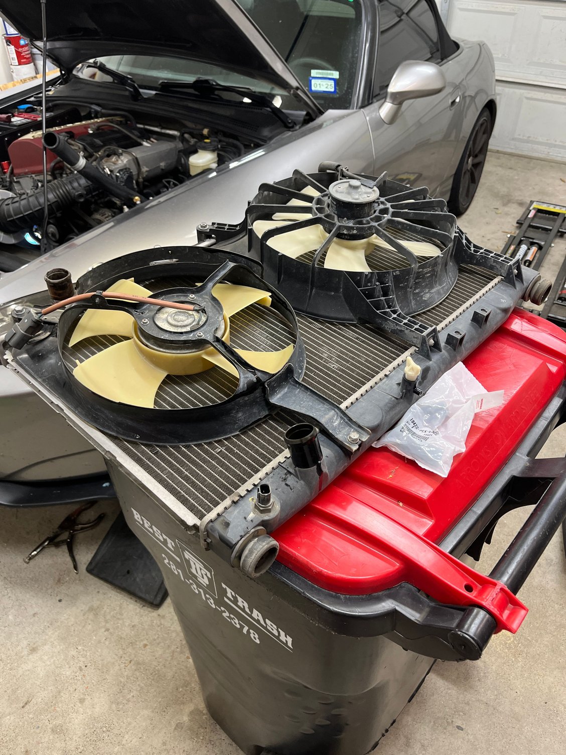Time to remove the 5 bolts to transfer fans, along with the thermostat and bottom bump stops. 