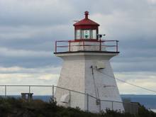 Cape Enrage Light
Cape Enrage is so named for the turbulent waters that pass over the reef which continues southward from the island for nearly a kilometer at low tide and the rough seas can be seen for much farther on windy days as the current and wind are in opposition.