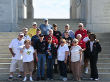 The group at the New York Monument.  Who is that guy in the back row in the blue and no hat??
