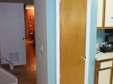 Not visible in the other view.  Stupid pantry.  Narrow door and 4 total shelves from the floor to the top.  This is being removed in favor of a matching cabinet/pantry.