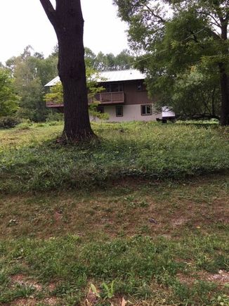 Not the best picture but I figured I would post know that I know how to! This bear was lying down in front of our house when I came home one Sunday afternoon. It was a few years ago.
