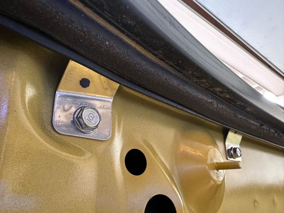 25 year old grime around the rear drain area. The weatherseal is also showing some age. 