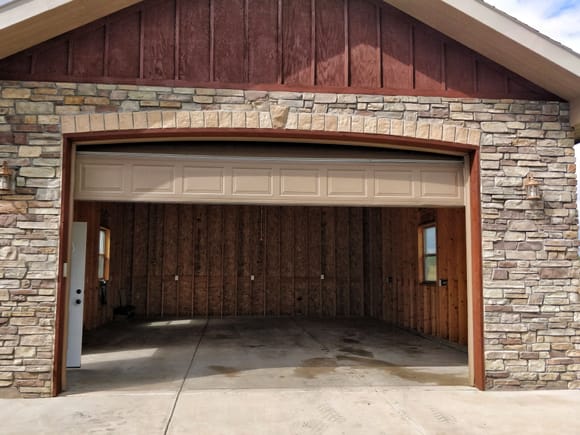 The detached garage needs a lot more than flooring.