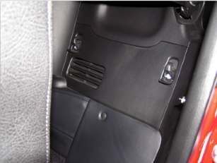 Behind driver's seat
