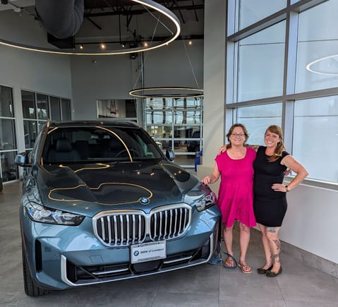 ^6-21-2024.  2025 BMW X5.  My sales person, Julie with me.  She was a delight.  We both teared up talking about our dogs.  We both have teal walls in our bedrooms.