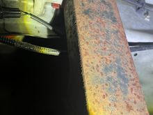 Pinned against the inner fender well