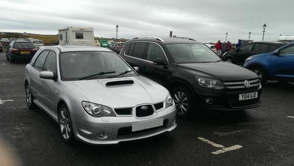 At john o groats before the drive home with my company car next to it.