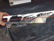 The aftermarket chain guard kept bending and breaking, but along the reline axis...inward toward the tire.