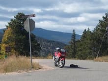 The bike pre streetfighter coversion (notice exposed rad due to busted plastics) on Golden Gate pass, a sweet twisty road hear in the front range.  Pic taken in fall of 08'