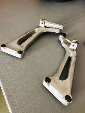 I'm going to chop off the rear foot peg retainers and smooth them out as I'll never have a passenger on the bike to worry about.  Got these as spares from a member here for which I'm grateful.  
These should be fun and will look good once done.  