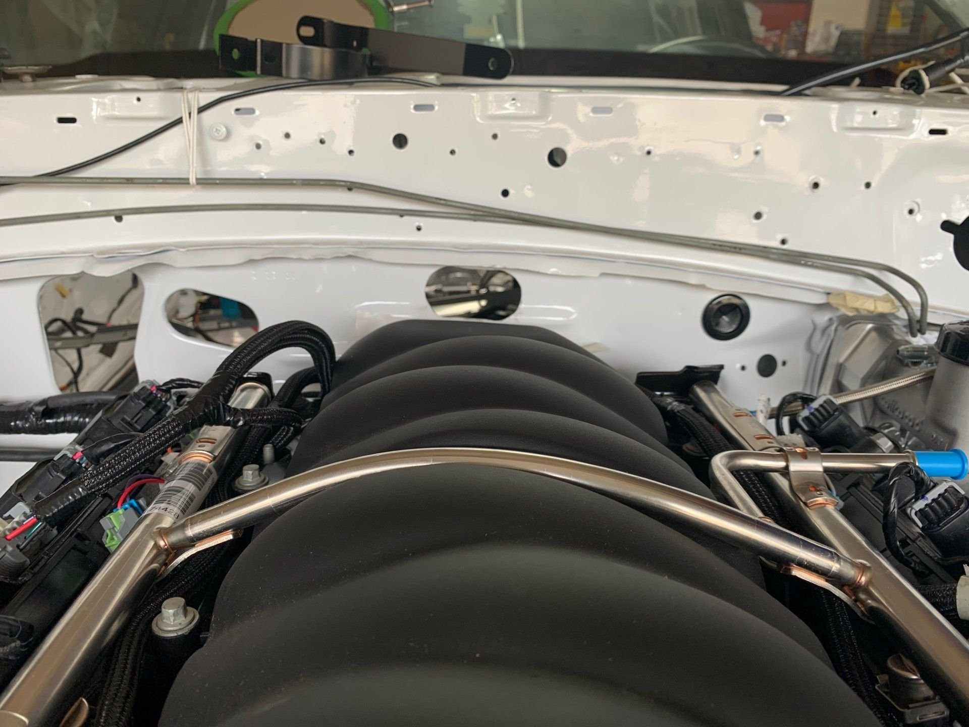 The new hole looks like the factory did it!