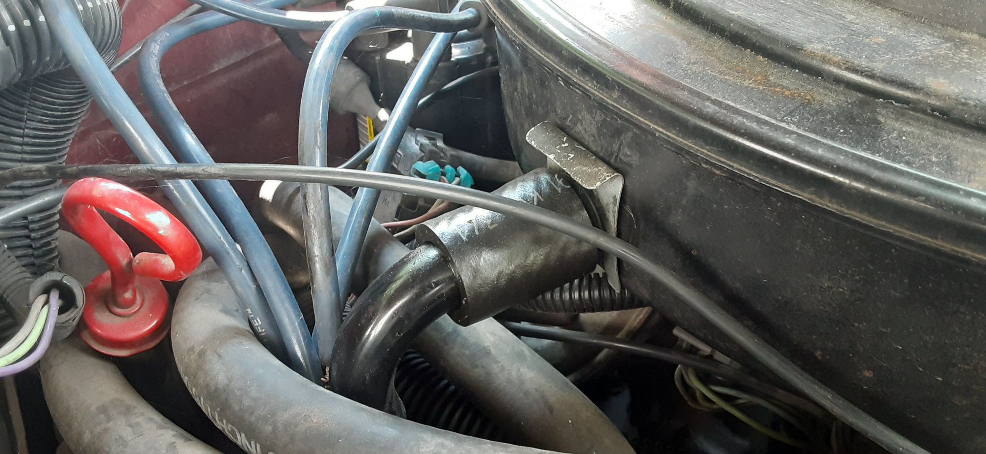 The metal spring clip that retains the little air cleaner assembly for the CCV system is installed like shown in this picture.