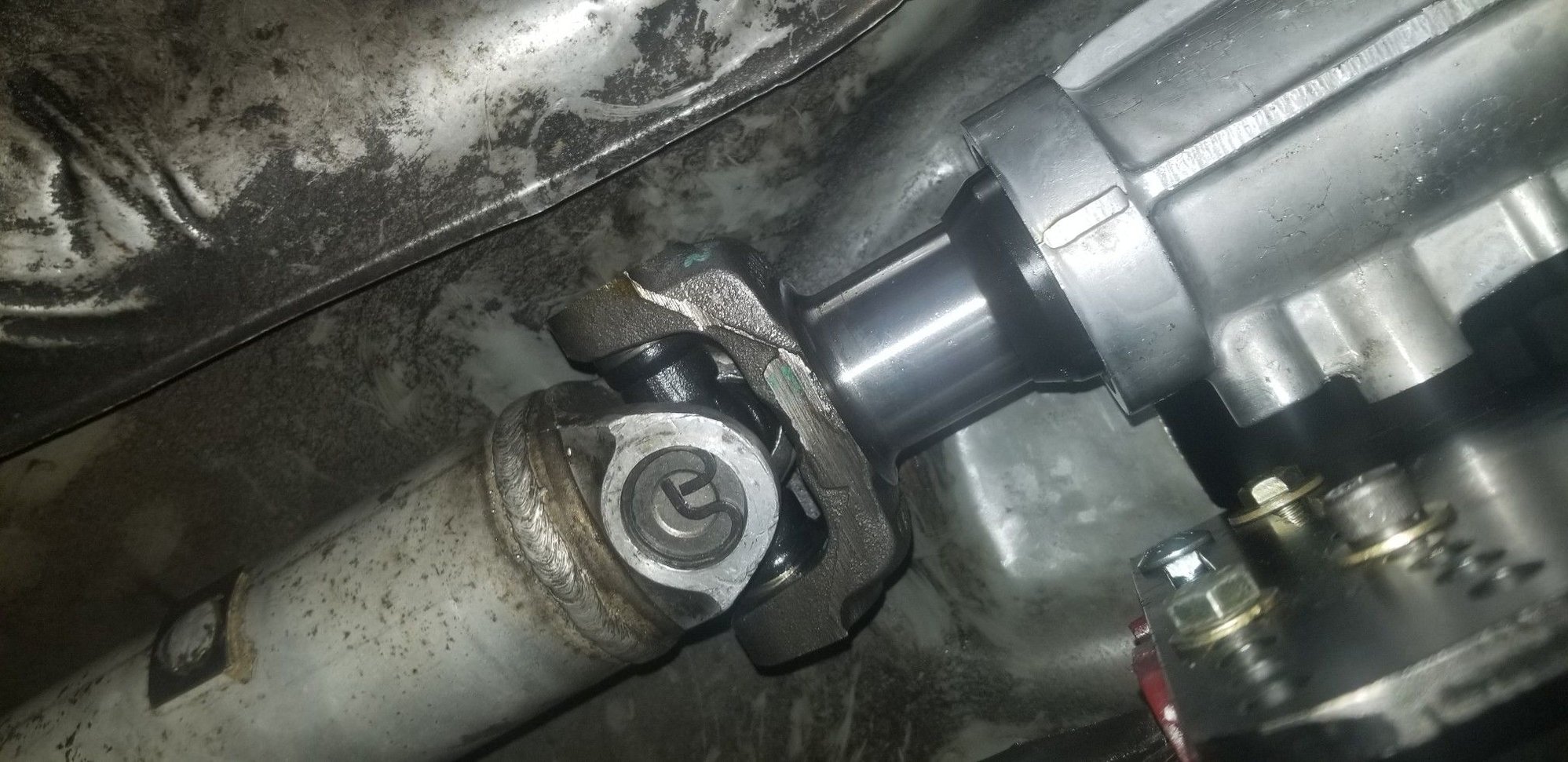 Fits like a glove, stock driveshaft is the perfect length!  A little bit more engagement wouldnt hurt, but theres still plenty of spline contact