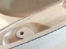 Then I ground the outer edges of the outer mounts to get them closer to the contour of the deck lid. I stopped when I got it flush with the stud mounting hole.
